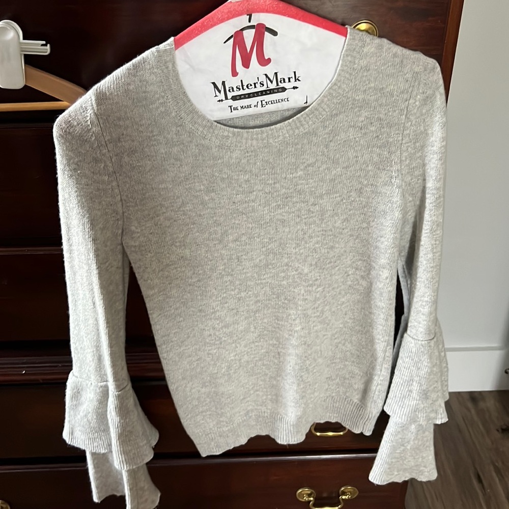 Gray sweater with detailed sleeves